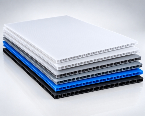 Stacked white, blue and black polypropylene flute sheets with hollow edges